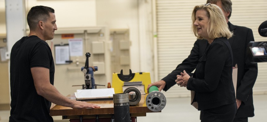 Christine Wormuth, Secretary of the Army, looks over various pieces of equipment produced at Rock Island Arsenal, Illinois, during a tour of the facilities, June 6, 2022. 