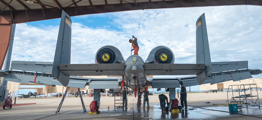 The A-10C Thunderbolt II Demonstration Team washes an A-10 Thunderbolt II at Davis-Monthan Air Force Base, Arizona, Oct. 6, 2022. 