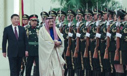Chinese President Xi Jinping (L) accompanies Saudi Arabia's king Salman bin Abdulaziz Al Saud (R) during a welcoming ceremony inside the Great Hall of the People on March 16, 2017, in Beijing, China.