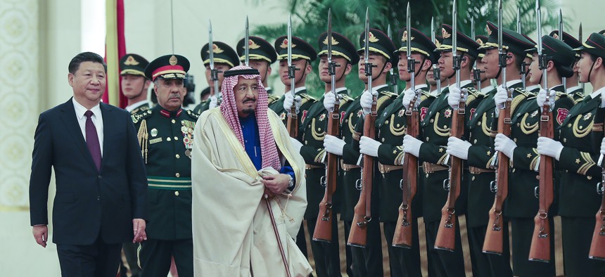 Chinese President Xi Jinping (L) accompanies Saudi Arabia's king Salman bin Abdulaziz Al Saud (R) during a welcoming ceremony inside the Great Hall of the People on March 16, 2017, in Beijing, China.