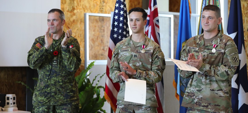 Brig. Gen. Pierre Huet, assistant commanding general for operations, XVIII Airborne Corps, congratulates winners of Dragons Lair IX, in Honolulu, Hawaii, on Nov. 2, 2023. 