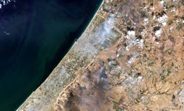 Satellite view of smoke plumes along the Gaza-Israel border, October 7, 2023. 