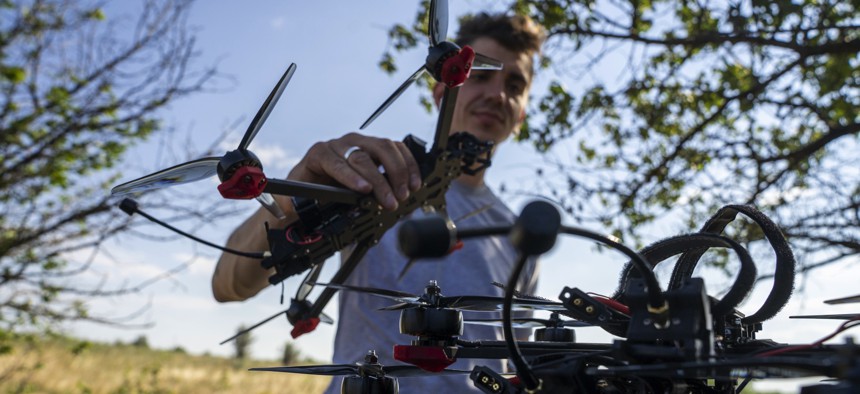 A soldier of the Ukrainian "Adam Tactical Group" tests kamikaze drones to be sent to the front line in Bakhmut, Ukraine, on August 6, 2023.