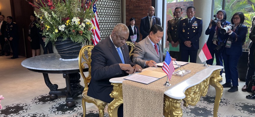 U.S. Defense Secretary Lloyd Austin and Indonesia Defense Minister Prabowo Subianto sign a defense cooperation plan in Jakarta, Indonesia. 
