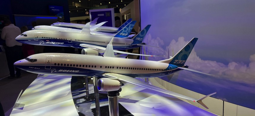 A row of models at Boeing's booth at the 2023 Dubai Air Show.