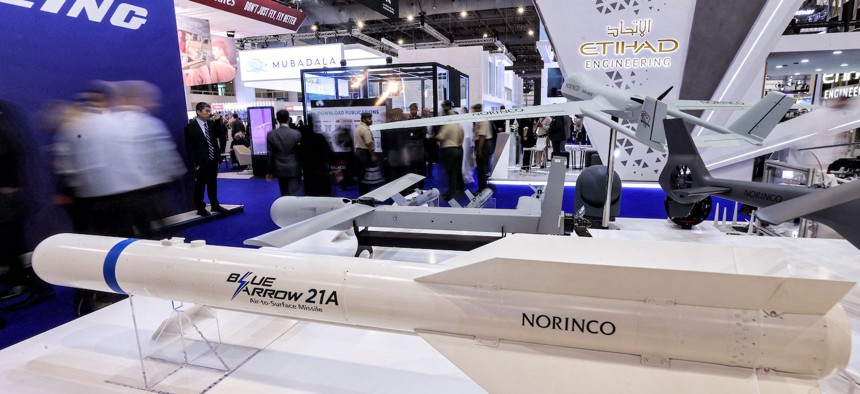 A Chinese Blue Arrow 21A air-to-surface missile is displayed near a Harbin BZK-005 unmanned aerial vehicle at the Norinco pavilion during the 2023 Dubai Airshow in Dubai on November 14, 2023.