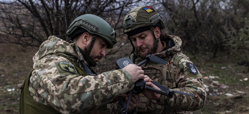 Ukrainian soldiers of the 22 Brigade train to use armed drones in Donetsk Oblast, Ukraine, on November 25, 2023.