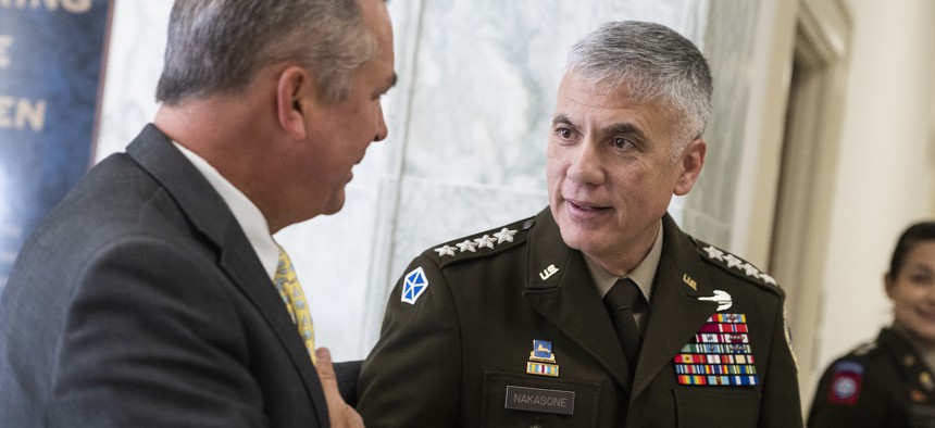 Gen. Paul Nakasone, commander of U.S. Cyber Command, and Rep. Don Bacon, R-Neb., talk in Rayburn Building on March 30, 2023.