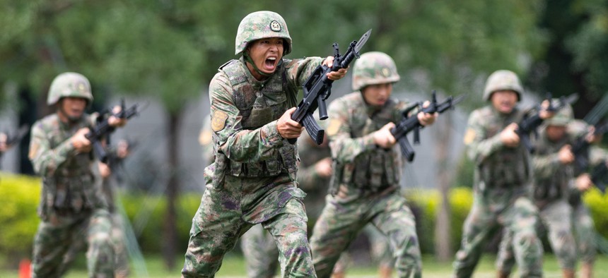 Soldiers of the Chinese People's Liberation Army Garrison stage military exercises during an open day event at the barracks on Taipa Island in Macao, China, April 30, 2023. 