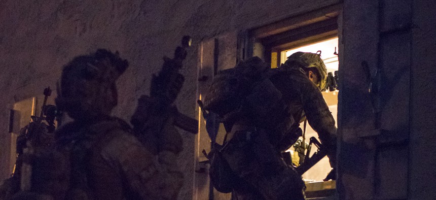 Italian Army Rangers with the 4th Alpini Regiment enter a building during a mission at the Joint Multinational Readiness Center in Hohenfels, Germany, April 25, 2018. 