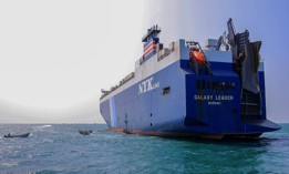 A picture taken during a tour organized by Yemen's Houthi rebels on November 22, 2023, shows the Galaxy Leader cargo ship, seized by Houthi fighters two days earlier, at a port on the Red Sea in Yemen's province of Hodeida. 