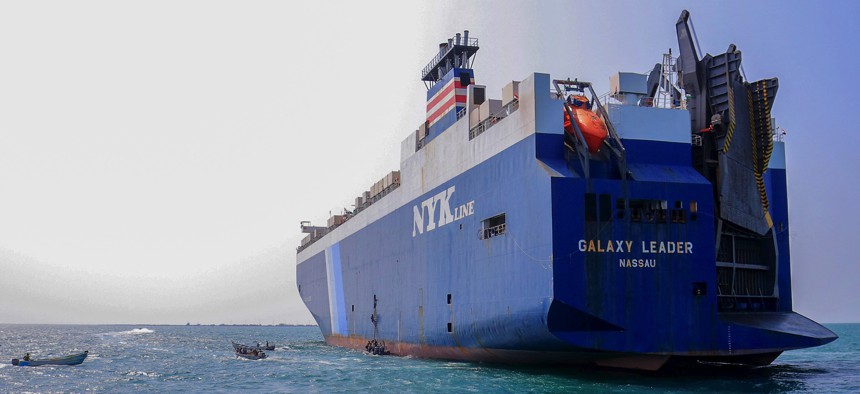A picture taken during a tour organized by Yemen's Houthi rebels on November 22, 2023, shows the Galaxy Leader cargo ship, seized by Houthi fighters two days earlier, at a port on the Red Sea in Yemen's province of Hodeida. 