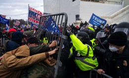 Pro-Trump supporters clash with law enforcement on the inauguration stage of the U.S. Capitol after President Donald Trump made false claims of election fraud on Jan. 6, 2021, in Washington, DC.