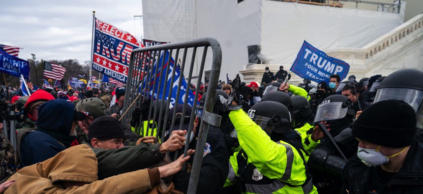 Pro-Trump supporters clash with law enforcement on the inauguration stage of the U.S. Capitol after President Donald Trump made false claims of election fraud on Jan. 6, 2021, in Washington, DC.