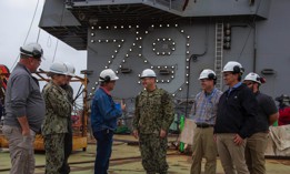 Naval Sea Systems Command's Rear Adm. Tom J. Anderson, discusses the construction of the aircraft carrier John F. Kennedy (CVN 79) with HII team leaders in Newport News, Virginia.