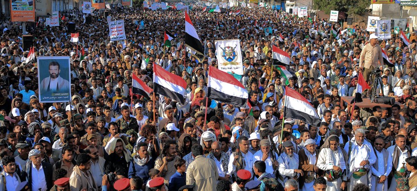 People take to the streets of the Yemeni Red Sea city of Hudeida, to protest the U.S. and British forces strikes on Houthi rebel-held sites.