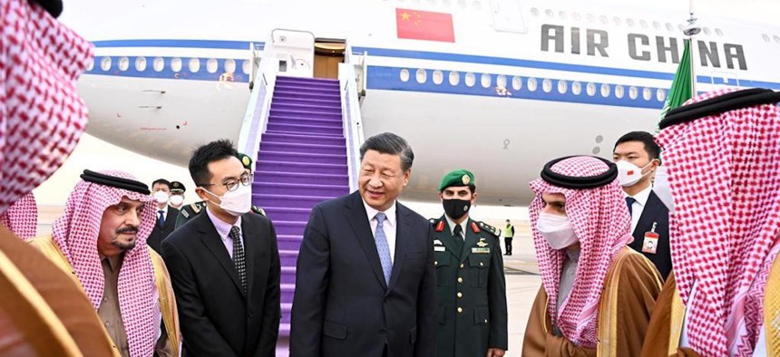 President of the People's Republic of China Xi Jinping (C) is welcomed by Emir of Riyadh Faisal bin Bende bin Abdulaziz (L) and Saudi Arabian Foreign Minister Faisal bin Farhan (R) at King Khalid International Airport in Riyadh, Saudi Arabia, on December 07, 2022.