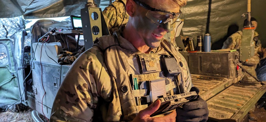 Maj. Eric Cannon uses the WinTAK device at the Joint Readiness Training Center in Louisiana. 