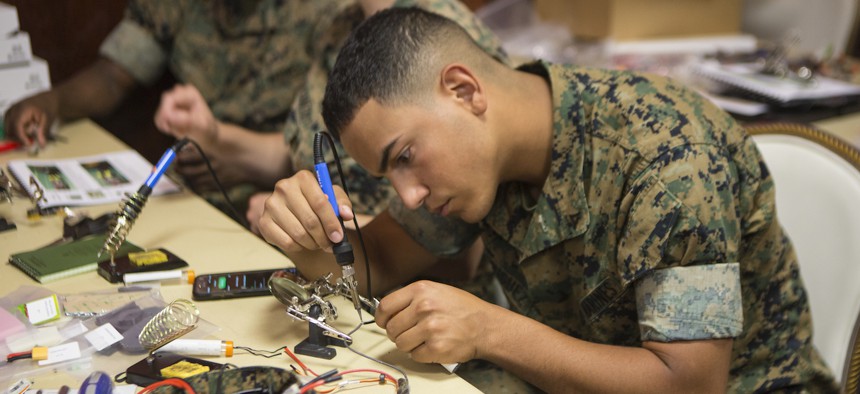 U.S. Marine Corps Lance Cpl. David N. Rodriguez assembles the Nibbler drone on Camp Lejeune, N.C., May 16, 2017.