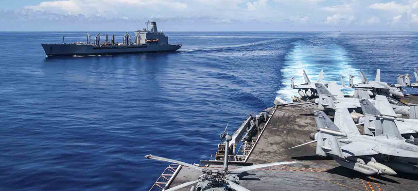 The USNS Yukon and the USS Ronald Reagan transit the South China Sea on Oct. 27, 2023.