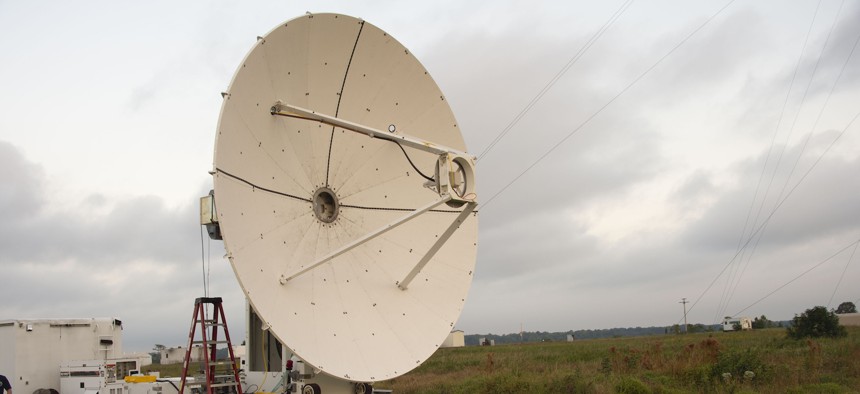A microwave dish transmitter is pointed toward a rectifying antenna in part of the Safe and Continuous Power Beaming – Microwave (SCOPE-M) demonstration at Army Blossom Point Research Field, Maryland, Sept. 21, 2021