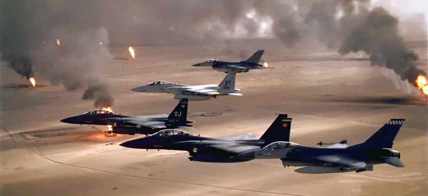 USAF aircraft of the 4th Fighter Wing fly over Kuwaiti oil fires, set by the retreating Iraqi army during Operation Desert Storm in 1991. 