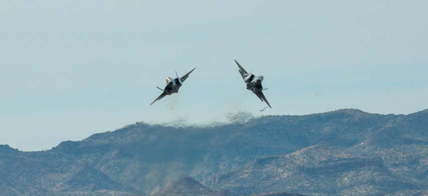 Two F-35 Lightnings assigned to the 56th Fighter Wing, perform an aerial maneuver over Barry M. Goldwater Range, Arizona, Jan. 19, 2024.