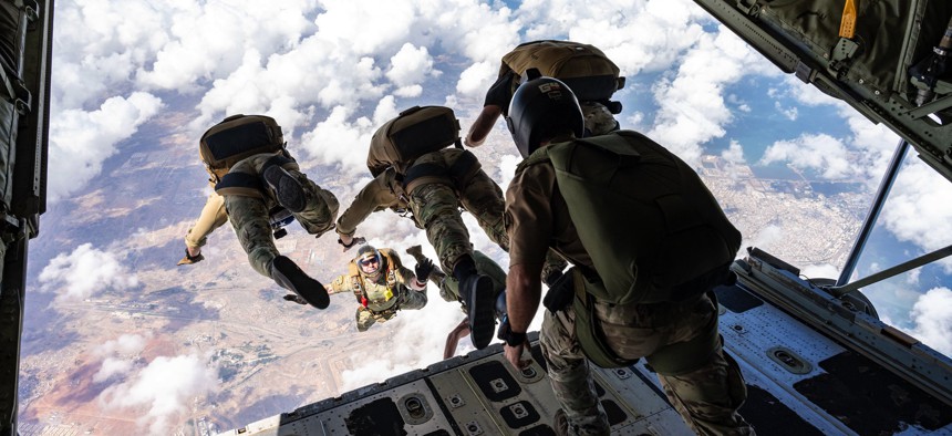 U.S. Air Force operators assigned to the 82nd Expeditionary Rescue Squadron and Joint Personnel Recovery Center perform high altitude, low opening training jumps from a U.S. Marine Corps KC-130J Hercules cargo aircraft over East Africa, Dec. 27, 2023. 