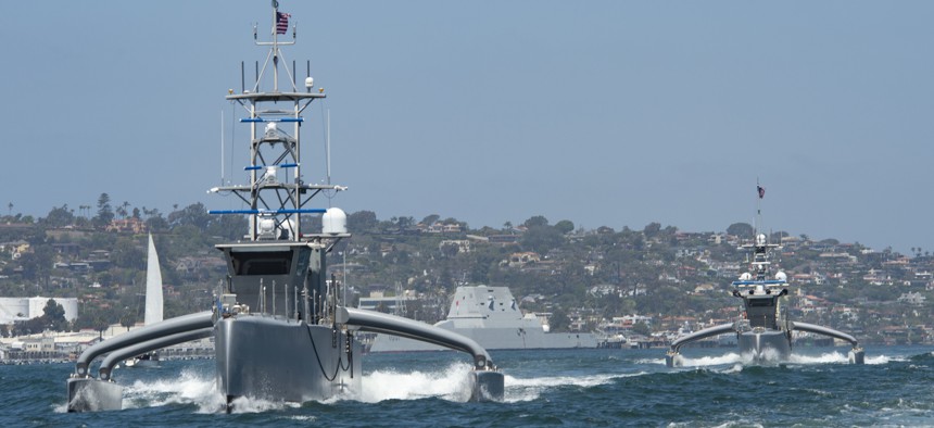 The medium displacement unmanned surface vessels Seahawk, front, and Sea Hunter launched for the U.S. Pacific Fleet’s Unmanned Systems Integrated Battle Problem 21 in April 2021.