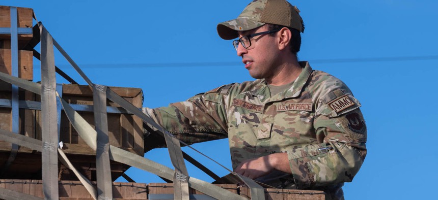 Airman 1st Class Daniel Contreras, 86th Munitions Squadron stockpile management crew chief, examines pallets of munitions on a truck at Ramstein Air Base, Germany, Jan. 25, 2024. 