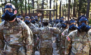 Army infantry recruits with the 2nd Battalion, 58th Infantry Regiment take on the gas chamber on Fort Moore, Georgia, March 30, 2023.