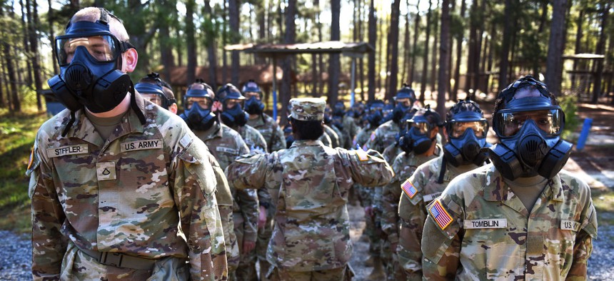 Army infantry recruits with the 2nd Battalion, 58th Infantry Regiment take on the gas chamber on Fort Moore, Georgia, March 30, 2023.