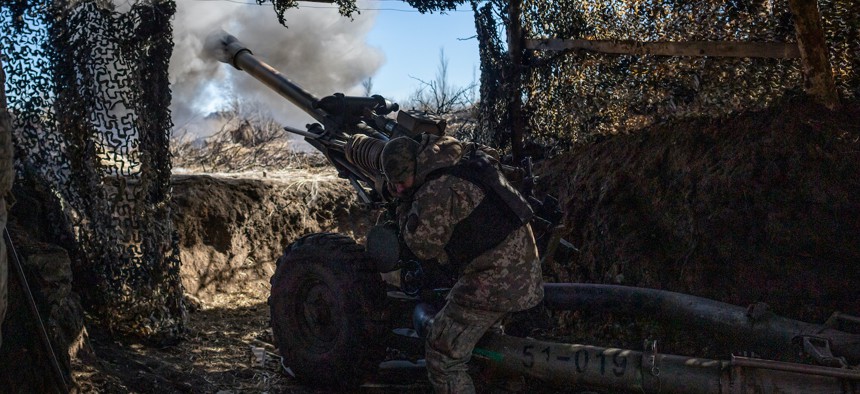 A Ukrainian serviceman of 79th brigade fires a 105 mm howitzer near the frontline outside of Marinka in Donetsk Oblast, Ukraine, on February 28, 2024. 
