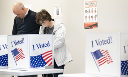 Voters look over their ballots at a polling location during early voting on February 22, 2024 in Columbia, South Carolina. 
