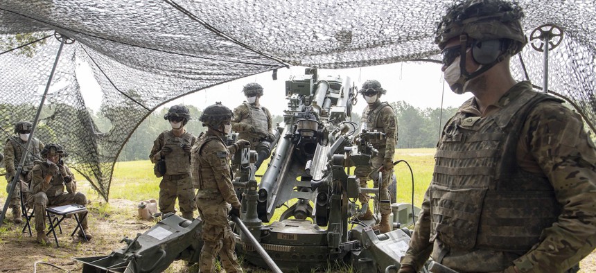 U.S. Army cannon crewmembers rehearse crew drills at Fort Polk, Louisiana, prior to a firing a M982A1 Excalibur precision munition from a M777 howitzer, June 27, 2020. 