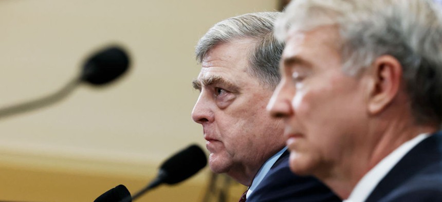 Former Chairman of the Joint Chiefs of Staff Mark Milley (L) and former Commander of the United States Central Command Kenneth F. McKenzie Jr., (R) participate in a hearing with the House Foreign Affairs Committee on March 19, 2024.