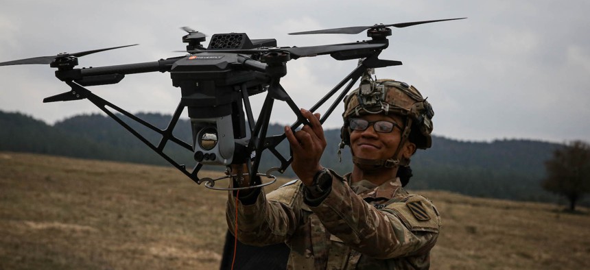 U.S. Army Sgt. Claudia Kinney, assigned to the 6th Squadron, 8th Cavalry Regiment, retrieves a drone during Allied Spirit 24 at the Hohenfels Training Area, Joint Multinational Readiness Center, Germany, March 6, 2024.