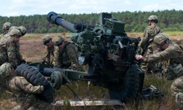 In this 2015 photo, U.S. Army soldiers assemble a M119 105mm Towed Howitzer.