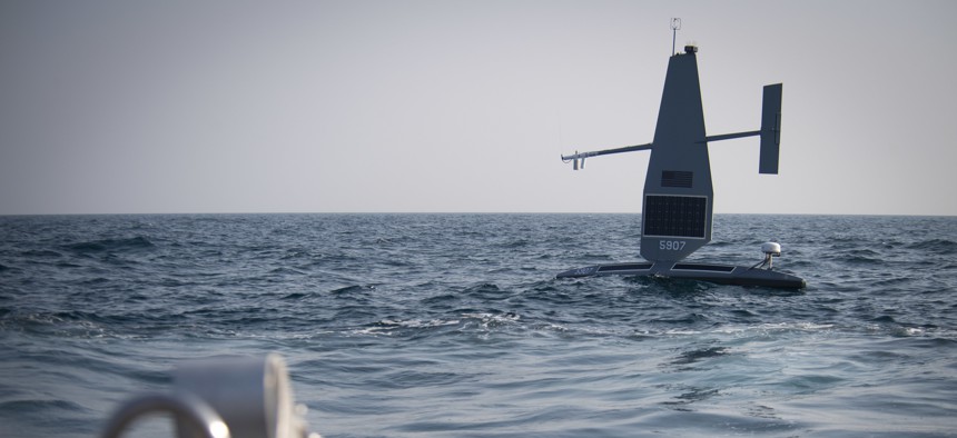 A Saildrone Explorer unmanned surface vessel (USV) operates in the Arabian Gulf during exercise Phantom Scope, Oct. 7. During the bilateral exercise between the United States and United Kingdom, USVs operated in conjunction with crewed ships and naval command centers ashore in Bahrain
