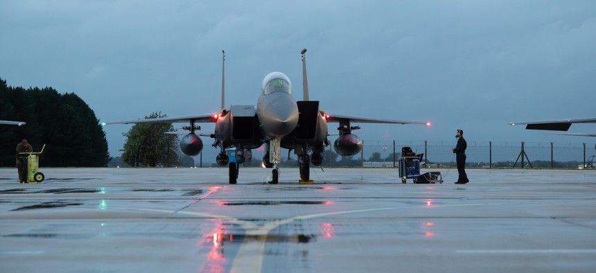 U.S. Air Force Airman 1st Class Smith Antone, 492nd Fighter Generation Squadron crew chief, conducts pre-flight checks of an F-15E Strike Eagle at RAF Lakenheath, England, during a deployment departure to an undisclosed location in Southwest Asia, Oct. 13, 2023. 