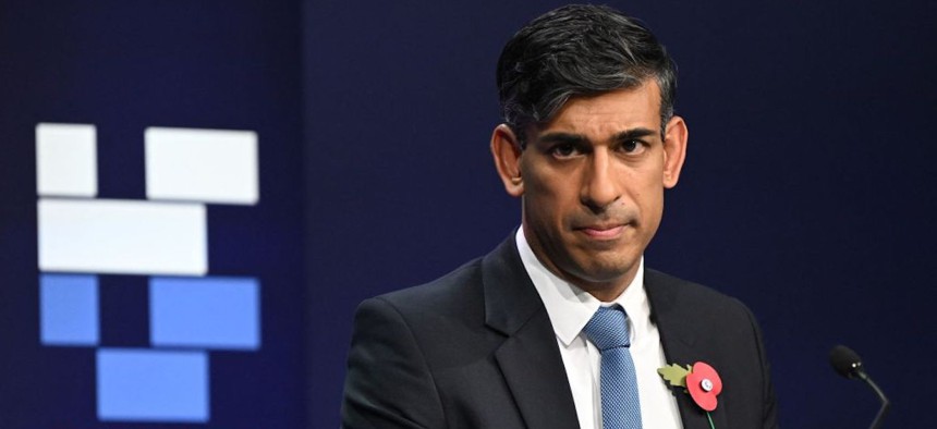 Britain's Prime Minister Rishi Sunak listens to a question as he holds the closing press conference during the UK Artificial Intelligence (AI) Safety Summit at Bletchley Park, in central England, on November 2, 2023.