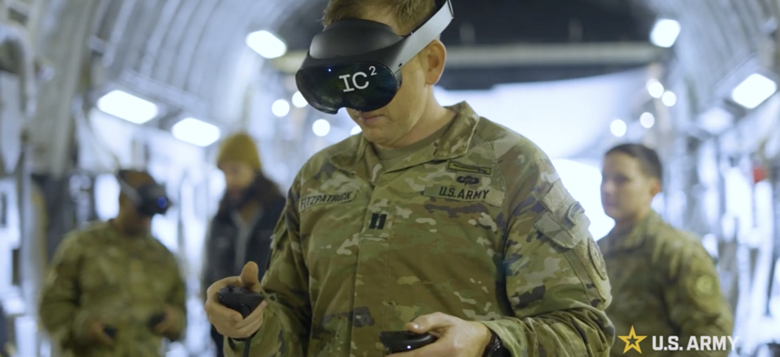 A member of the Germany-based Europe-based 2nd Cavalry Regiment tries out a virtual command post accessed via augmented reality goggles from Palantir’s Immersive Command and Control, or IC2 