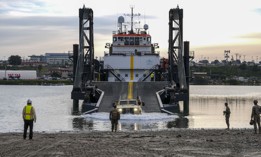  A Joint Light Tactical Vehicle drives off of the ramp of a Stern Landing Vessel, a modified oil-rig industry off-shore support vessel, in order to transport personnel off of the vessel as part of Project Convergence Capstone Four, Feb. 23, 2024 at the Del Mar Boat Basin, Camp Pendleton, CA.