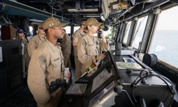 Ensign Emily Moore and Ensign Joshua Andrews stand watch aboard the Arleigh Burke-class guided-missile destroyer USS Mason (DDG 87) while the ship operates in support of Operation Prosperity Guardian in the Gulf of Aden, Dec. 26, 2023.