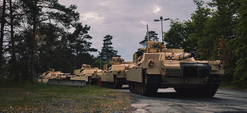 U.S. M1A1 Abrams tanks needed for training the Armed Forces of Ukraine await transport to training areas at Grafenwoehr, Germany, May 14, 2023. 
