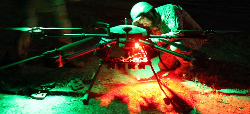 A serviceman of the battalion of unmanned attack air systems "Achilles" of the 92nd Separate Assault Brigade prepares the "Vampir" night drone for the operation at a front-line position near the town of Chasiv Yar, Donetsk region, on April 22, 2024.