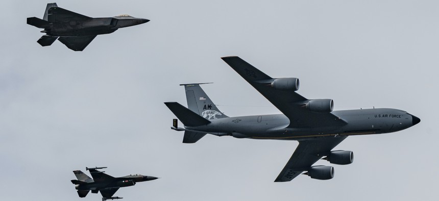In this 2021 photo, several types of U.S. Air Force aircraft fly in formation during an air show in Alaska. 