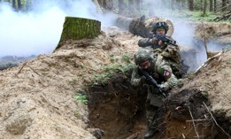 Soldiers practice clearing a trench during drills at a training area in Zhytomyr region, northern Ukraine, April 23, 2024.
