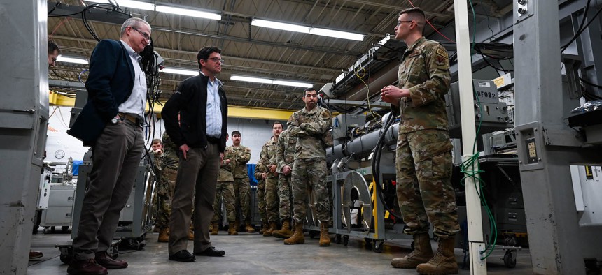 John Plumb, assistant secretary of defense for space policy, receives a brief from U.S. Air Force Staff Sgt. Matthew Berg, 36th Electronic Warfare Squadron EW systems journeyman, during a tour of the 350th Spectrum Warfare Wing at Eglin Air Force Base, Fla., March 11, 2024.