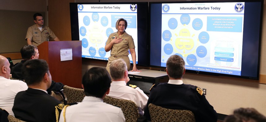 Vice Adm. Kelly Aeschbach, commander, Naval Information Forces, discusses Navy Information Warfare missions and priorities with allied and partner naval attachés during a visit to the Pentagon, Feb. 2, 2023. 